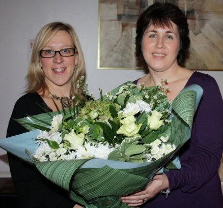 Elizabeth Masterson, on behalf of the Centenary Committee, makes a presentation to Orla Higgins
